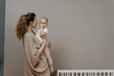mother holding baby