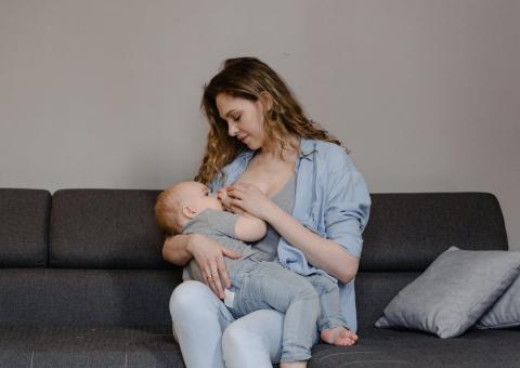 Woman breastfeeding child