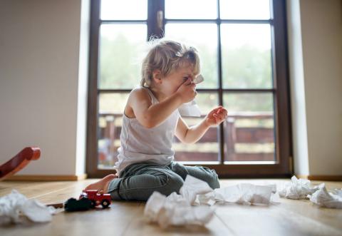 Girl blowing her nose