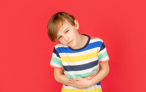 Boy holding stomach