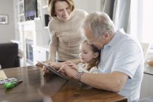Grandparents doing a videocall with their granddaughter