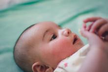 A child looking at her or his hands
