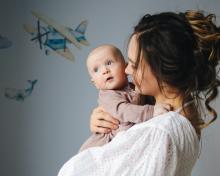 Mother giving a comforting smile to her child