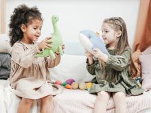 Two girls playing with toys