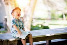 toddler playing reading