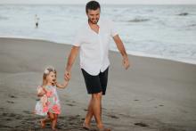 Father with daughter holding hands