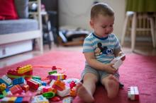 A boy playing on the floor