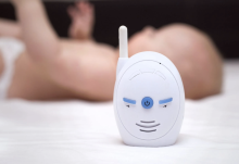 Baby next to breathing monitor