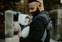 Father carrying baby in baby carrier