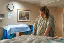Woman giving birth at birthing center