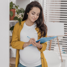 Woman looking at newborn checklist